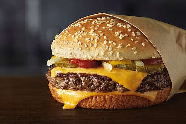 A close-up view of a McDonald's Quarter Pounder.