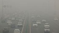 Traffic passes on a road as the sky is enveloped with smog after Delhi's air quality turned "severe" due to alarming air pollution, in New Delhi, India, November 18, 2024. REUTERS/Anushree Fadnavis TPX IMAGES OF THE DAY