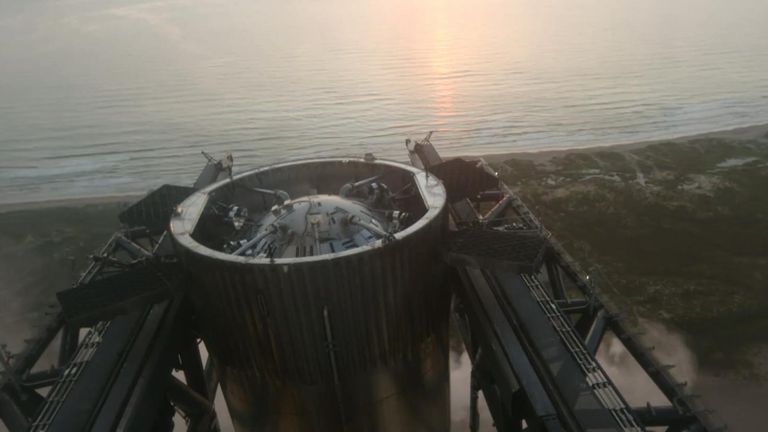 The booster rocket clamped back in place by the 'chopsticks'. Pic: SpaceX