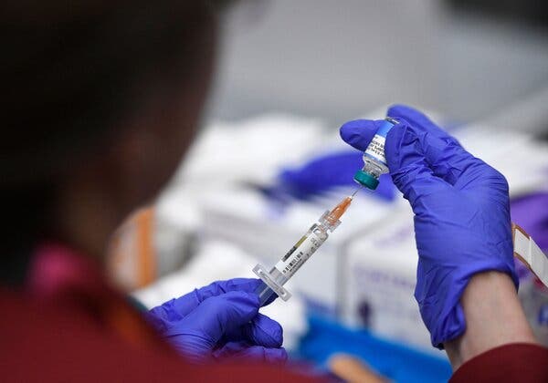230cdc-measles-kennedy-zmlp-articlelarge Gloved hands fill a syringe from a vial.